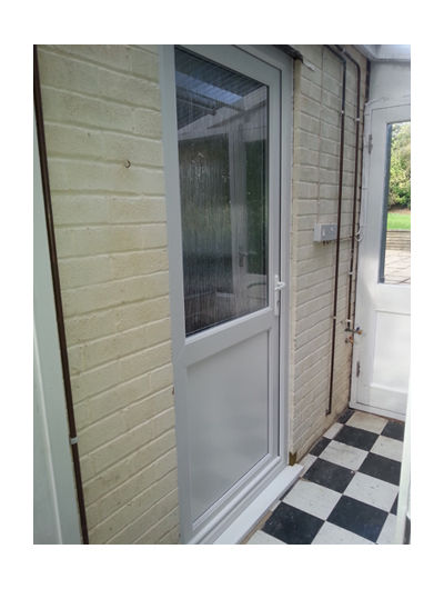 White UPVC door in porch