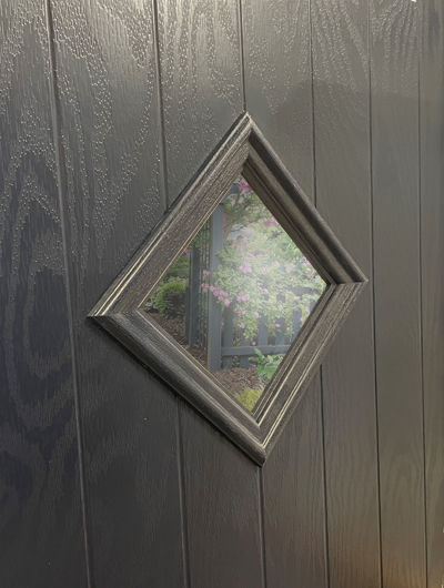 Closeup of the diamond glass panel on a cottage style composite door