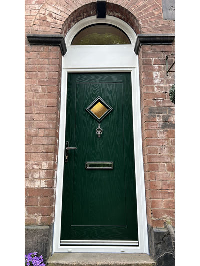 Dark green composite door with arched toplight
