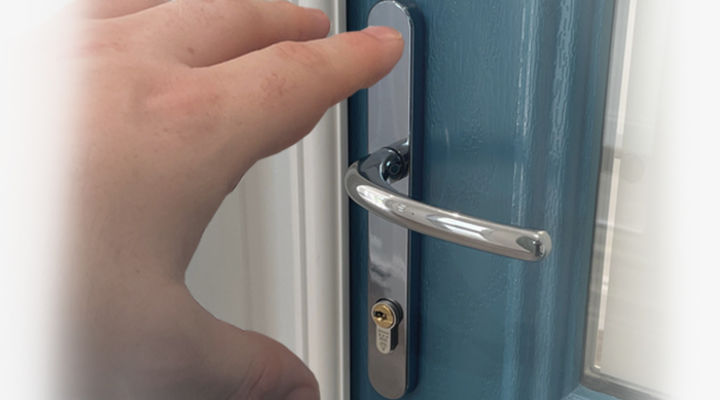 Hand reaching for door handle