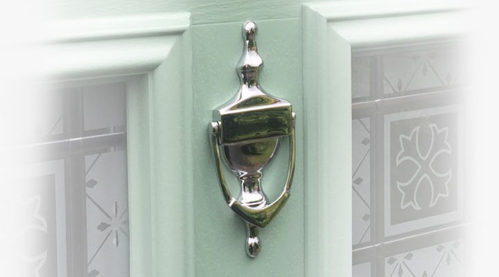 Chrome Victorian Urn knocker on a light green composite door