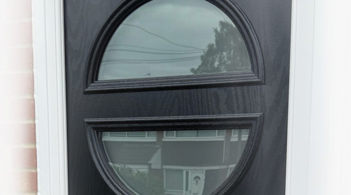 Composite door closeup of twin half moon glass