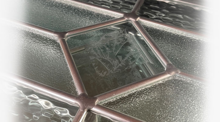 Closeup of a triple glass design with textures and zinc came