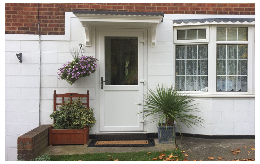A half glazed white UPVC door in a house