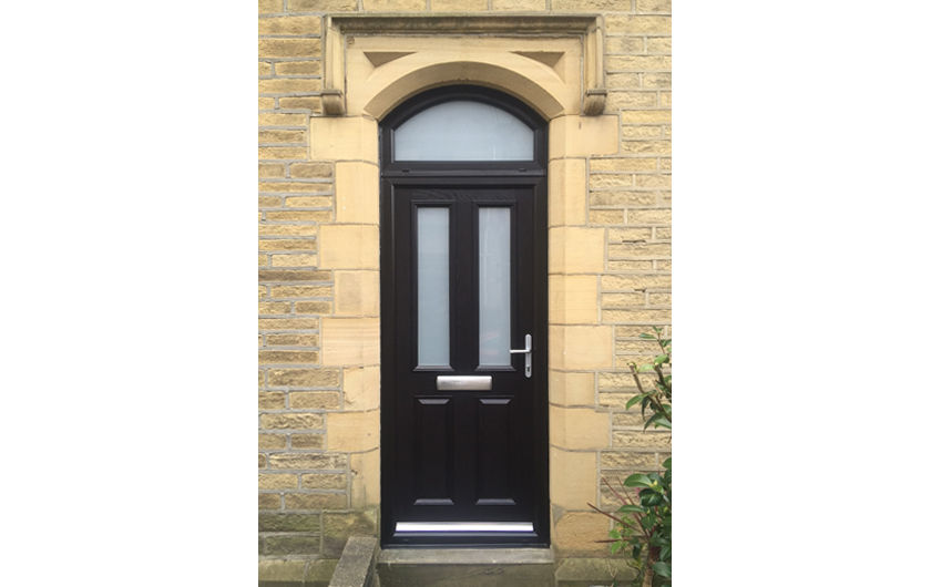 Black twin vertical composite door with an arched toplight