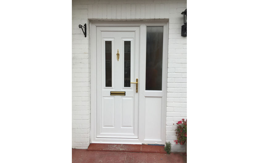 White twin vertical UPVC door with galf glazed side panel