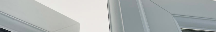 Close-up of white UPVC french doors showing mullion on slave door