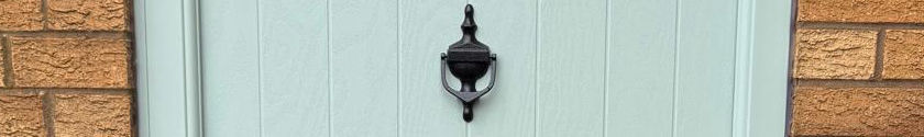 Black victorian urn knocker in a duck egg blue cottage composite door