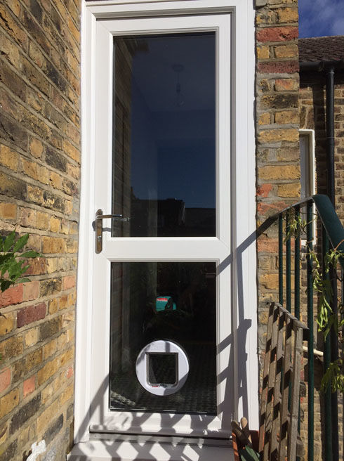 Fully Glazed with Midrail white upvc back door with catflap