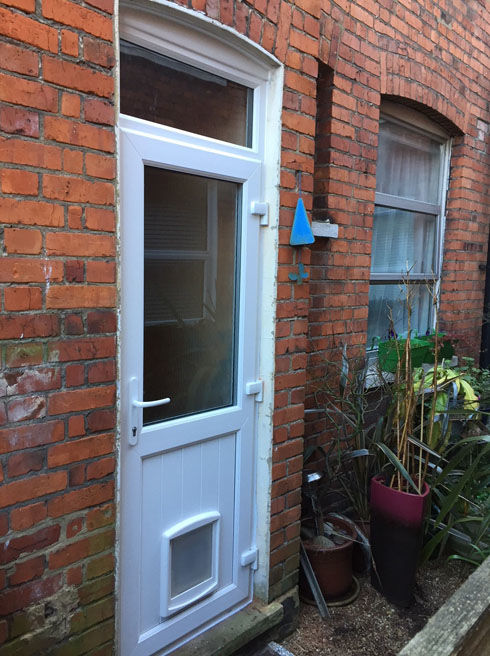 Cardiff Attina white upvc back door with catflap and toplight