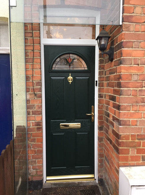 Surrey Fia green composite front door with toplight